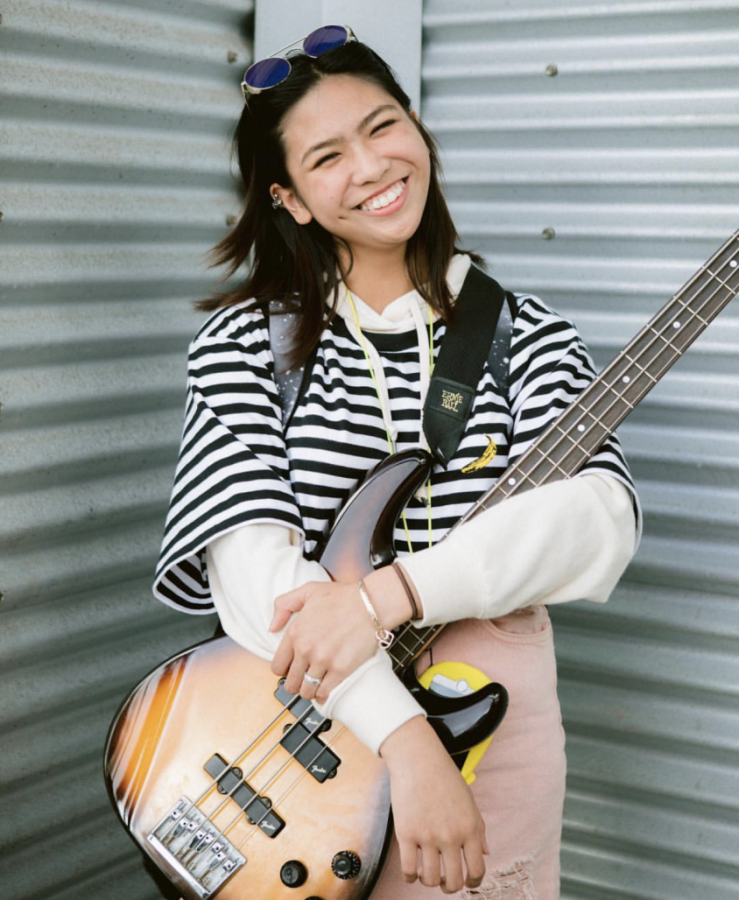 Manamtam poses with her guitar. 
