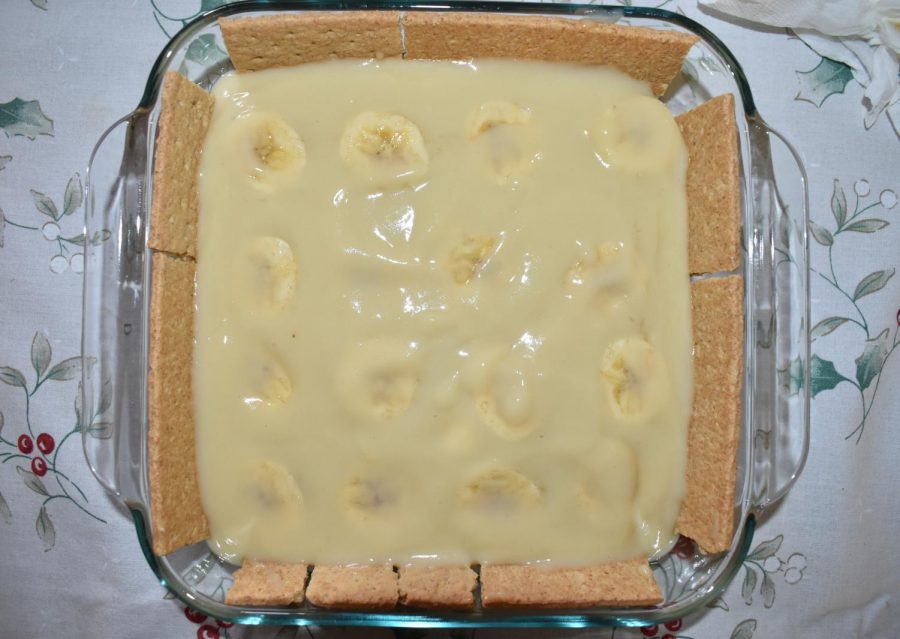 A final layer of banana pudding is placed on top.