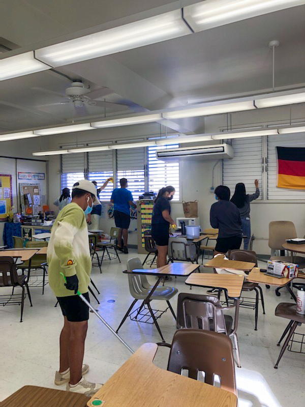 DECA cleans the classroom.
