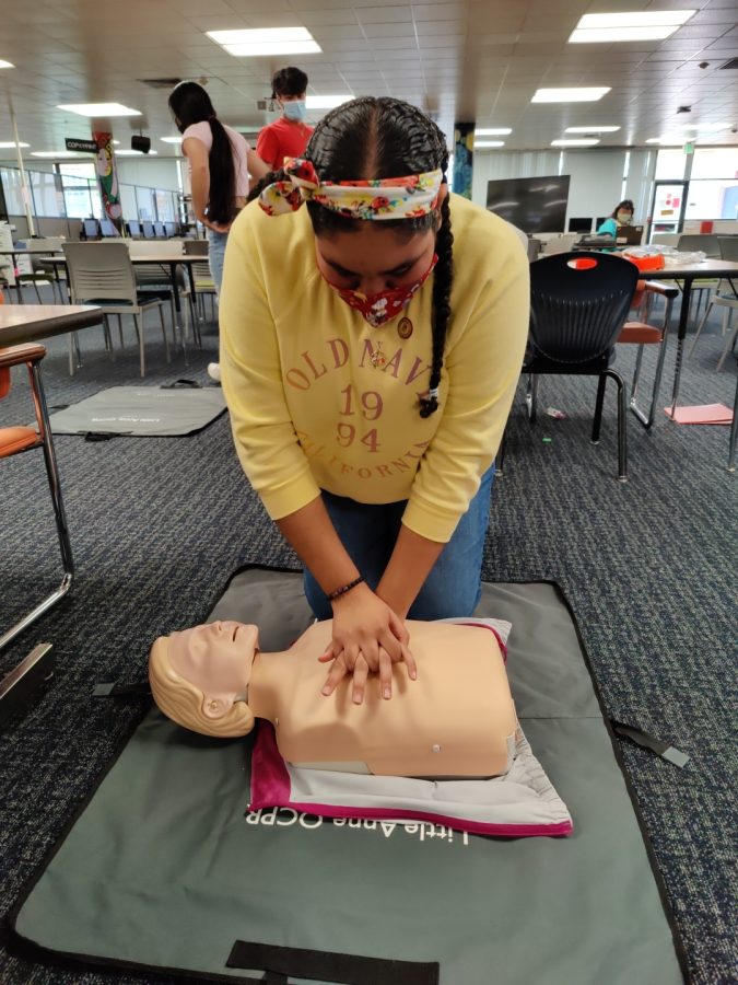 Senior Rosalyn Sproule practices chest compressions at the Jan. 13 class. Two earlier sessions were held Jan. 6-7.