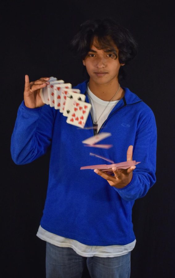 Junior Chris Dias started to showcase his passion for card tricks in Peer Education Programs booths to educate students about topics including drug use and suicide prevention.