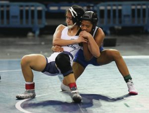 Junior Isabelle Asuncion (in blue) won in the 117-pound division.
