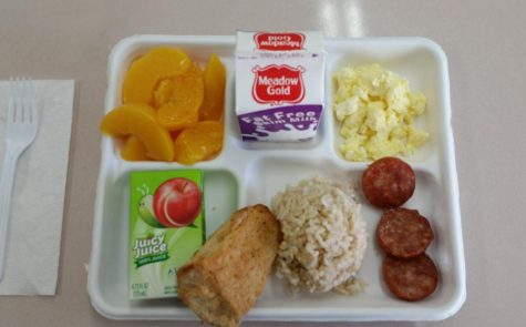 School breakfast: Portuguese sausage with rice, peaches, and eggs. 