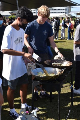 FCCLA students pan fry noodles for students to taste at last years inaugural Turkey Trot Health Fair. The group will work with the culinary classes to continue the tradition on the athletic field.