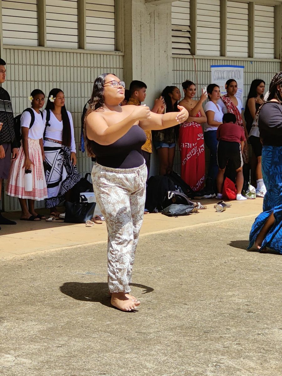 Jahzayrah Dela Cruz feels the music as she performs with the Polynesian Dance Club during lunch Sept. 26.