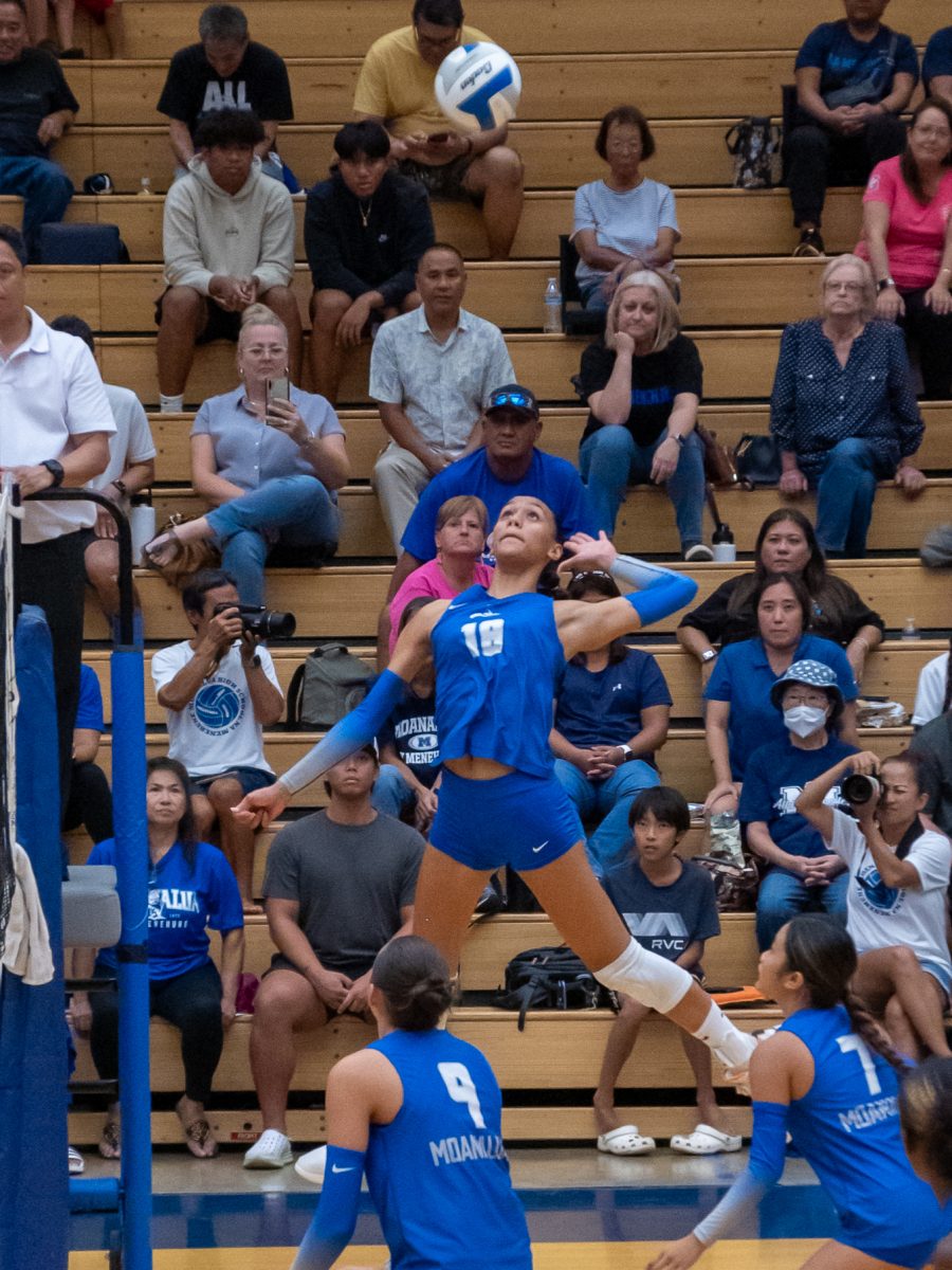 Outside hitter Malu Garcia jumps up to slam the ball over the net. Na Menehune defeated Farrington 25-7, 25-11, 25-10 at the school gym Oct. 3.