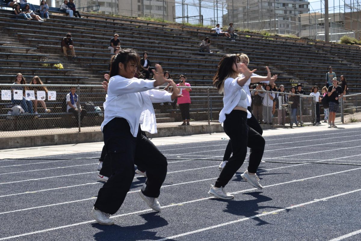 Expo, the advanced dance group, hyped up the crowd with a routine on the new track.