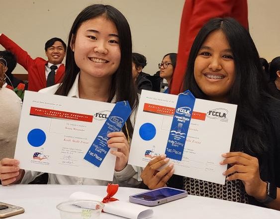 Kiara Watanabe (left) and Neveah Terrado hold up their blue ribbons for taking first in the knife skills competition at the recent CTSO convention.