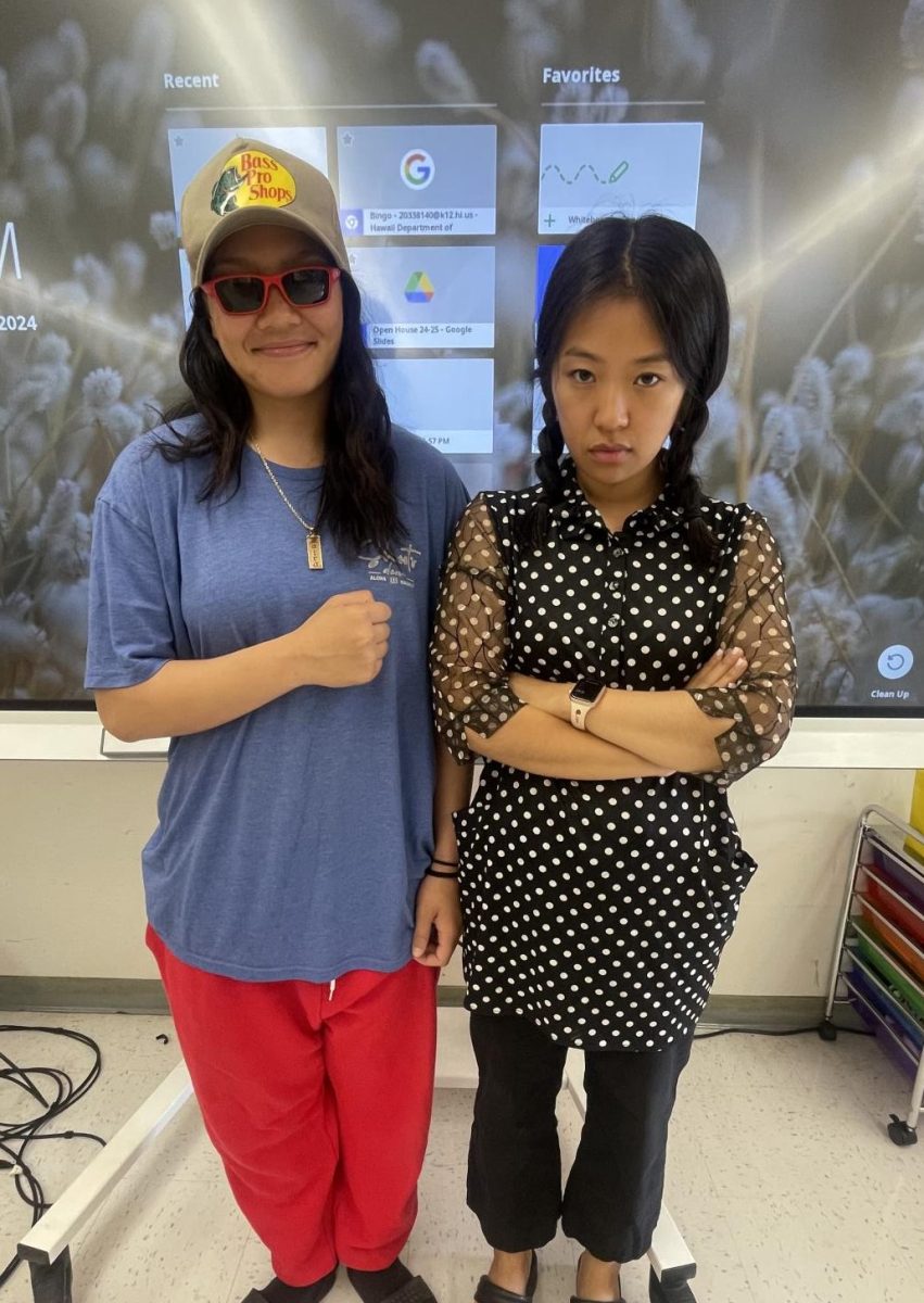 Zaira Sugui (10) and Ms. Whang pose for Wednesday's spirit week theme: Adam Sandler versus Wednesday Addams modeling how a good costume is creative, funny, and doesn't break the bank! 