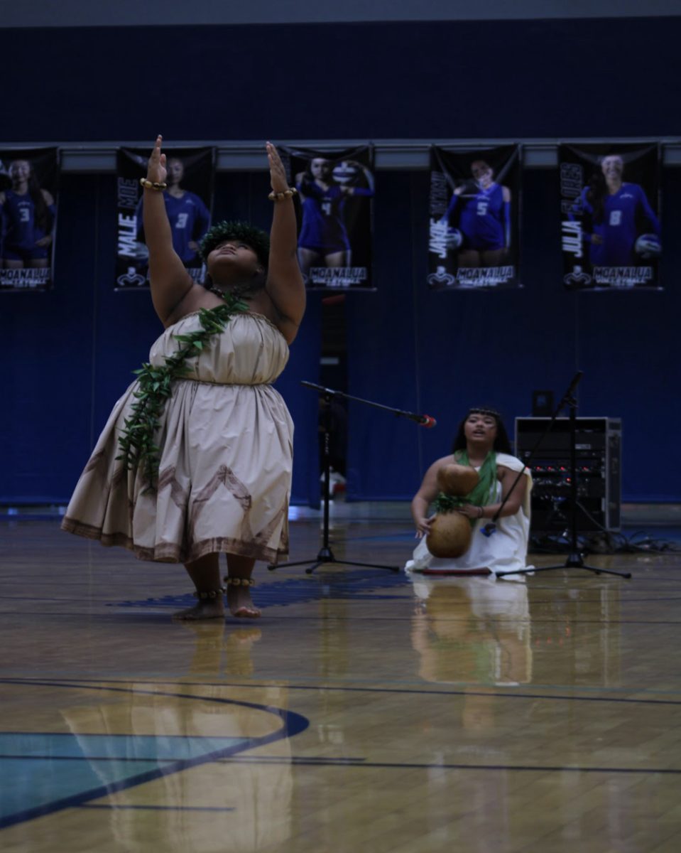 Edrina Taylor-Kinin perform hula while Randi Racadio chants. They sing “Hana Waimea” by Mark Keali’i Ho’omalu. 

Racadio and Taylor-Kinin won first place in the talent show.