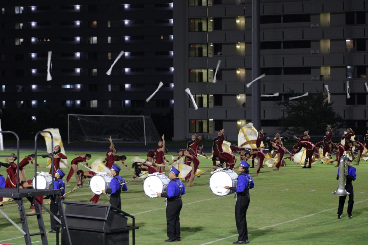 The rifles and flags of the color guard section present an iconic "Moanalua" visual.
