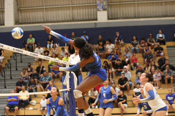 Outside hitter Zaria Queen jumps up for a kill during a Moanalua home game in her senior year volleyball season.