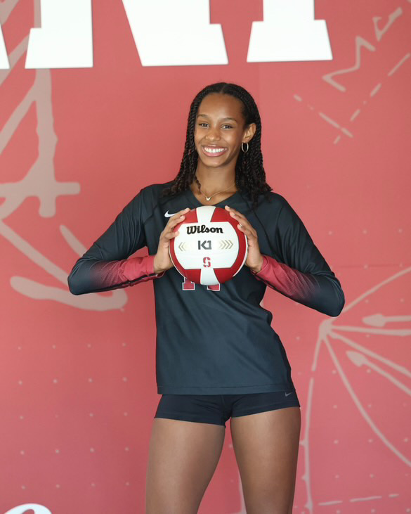 Zaria Queen poses with her Stanford jersey and volleyball.