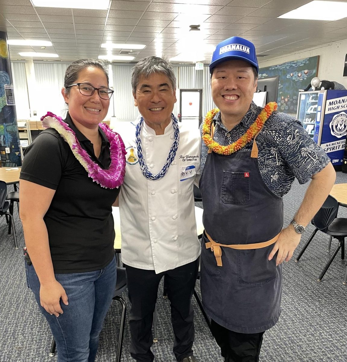 Chef Roy Yamaguchi from Roy’s Waikiki poses with Baker Justine Perkins and Chef Lars Mitsuda for Culinary Event in MoHS Library