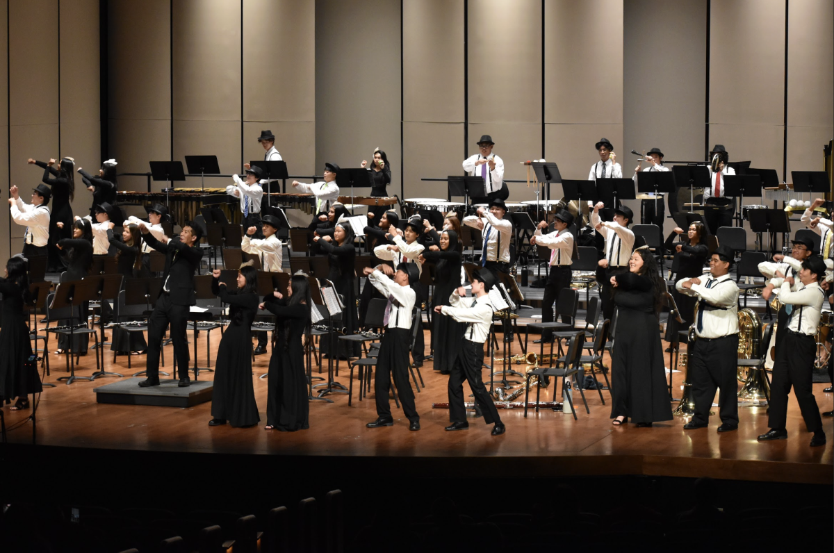 Symphonic Wind Ensemble (SWE) dances during the piece "Samba de Loves You." Photo credits to Jazmin Gamiao & Matthew Barut.