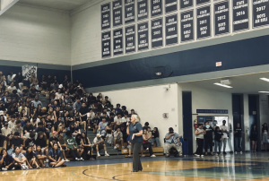 Principal Martin congratulates the sports teams that won state championships. 